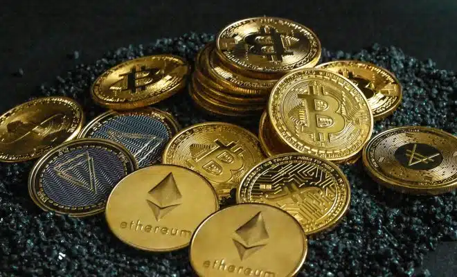 a pile of bitcoins sitting on top of a pile of gravel